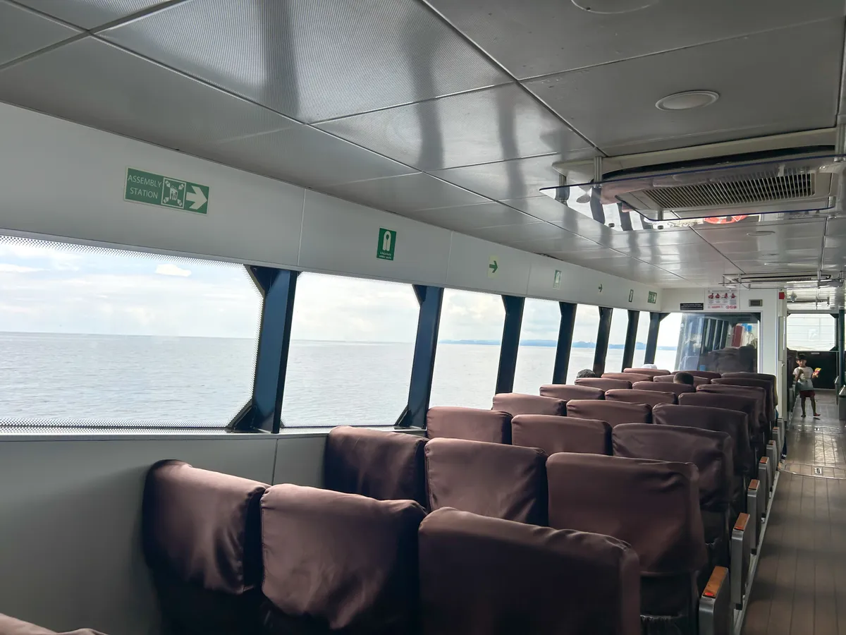 ITT Majestic interior — panoramic windows run the full length of the vessel ITT Majestic interior with panoramic windows and seating