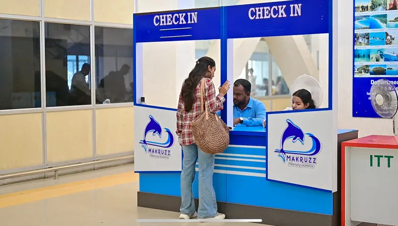 Makruzz check-in – arrive 60-90 minutes early for smooth boarding Makruzz check-in counter at Haddo Jetty with passengers