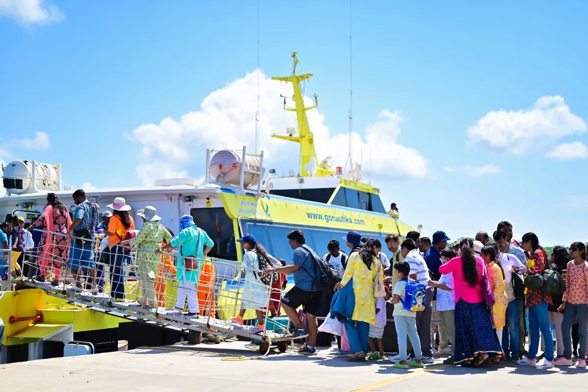 Organized QR code boarding — Nautika maintains 85% on-time departure performance Passengers boarding Nautika ferry at Andaman jetty